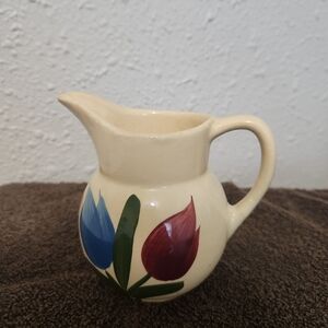 Elegant Ceramic Pitcher with Red and Blue Floral Design